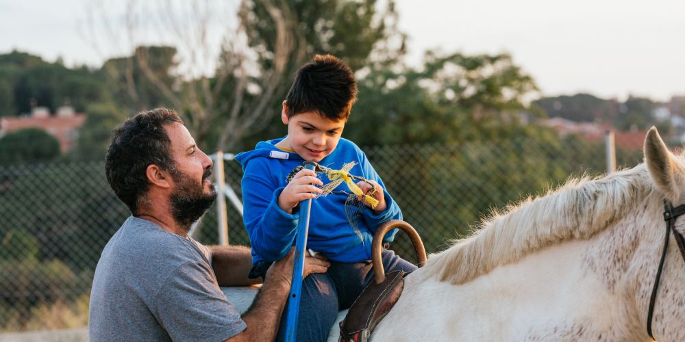 Supporting the Therapy Horses of NCEFT with StreamZ, boy on horse having fun